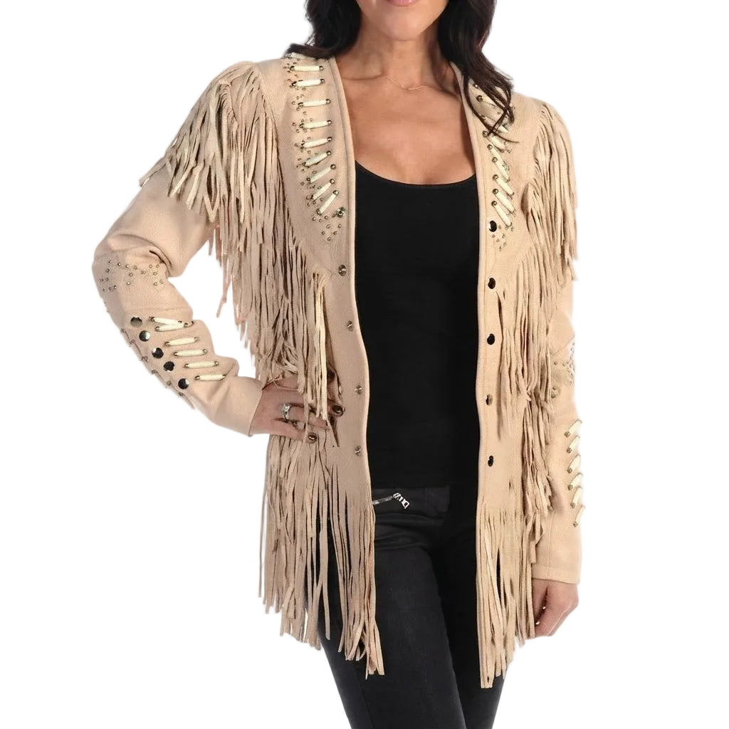 A woman wearing a beige fringed cardigan with decorative metallic studs and lace-up details on the sleeves, styled over a black top and black pants against a white background.