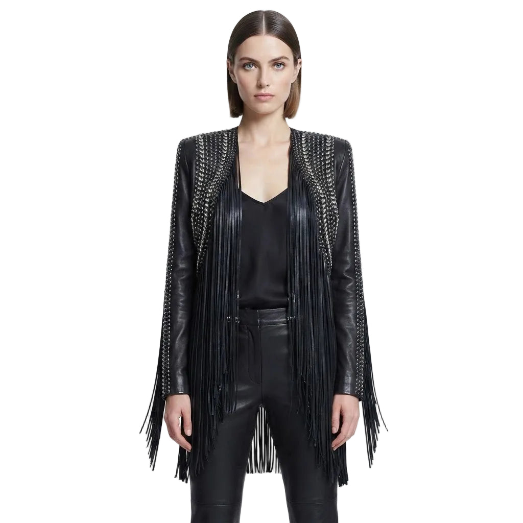 A model wearing a black leather fringe jacket with silver chain detailing on the shoulders, styled over a black top and black leather pants against a white studio background.