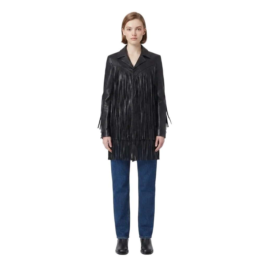 A model stands against a plain white studio background wearing a black leather fringe jacket, blue jeans, and black shoes.