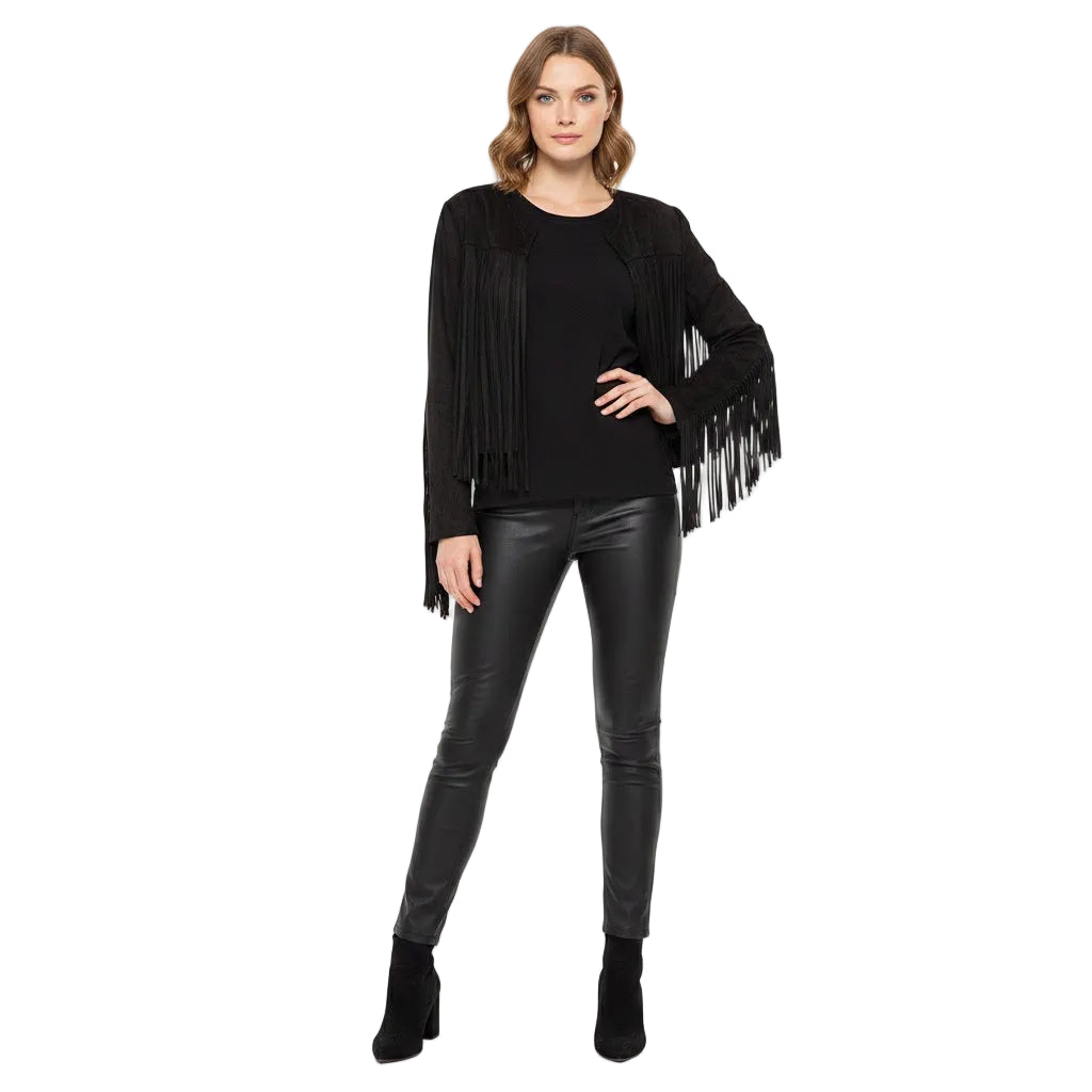 Woman wearing a black fringe jacket, black top, and black leather pants on a white background