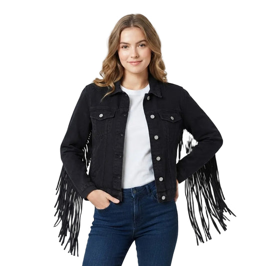 A woman modeling a black fringed leather jacket over a white t-shirt and blue jeans, photographed against a white studio background.