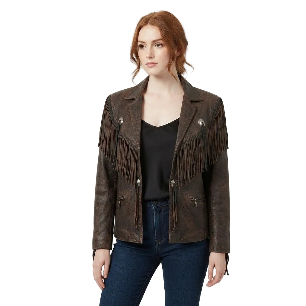 A woman modeling a dark brown distressed leather fringe jacket over a black top and blue jeans, photographed against a white studio background.