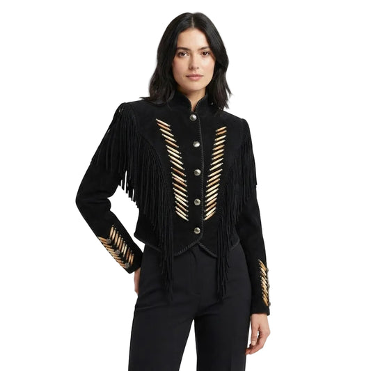A woman modeling a black fringed jacket with gold embroidered chevron patterns on the front and sleeves, paired with black pants, against a plain white studio background.