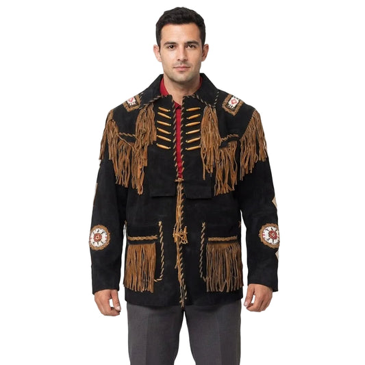 A man wear a black suede fringed jacket with tan fringe, red cord trim, and circular bead work on the sleeves, paired with gray pants against a white background.