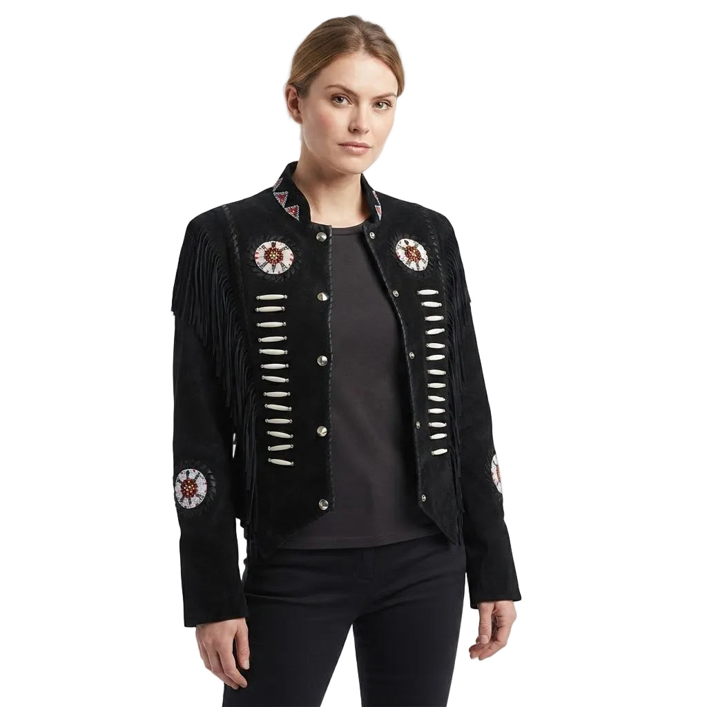 A woman modeling a black suede fringe jacket with silver-toned buttons and circular embroidered details on the chest and sleeves, paired with a dark top and black pants against a white studio background.