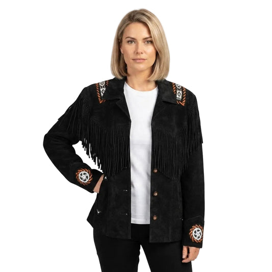 A woman modeling a black suede fringe jacket with embroidered details on the shoulders and cuffs, worn over a white t-shirt and black pants against a white background.