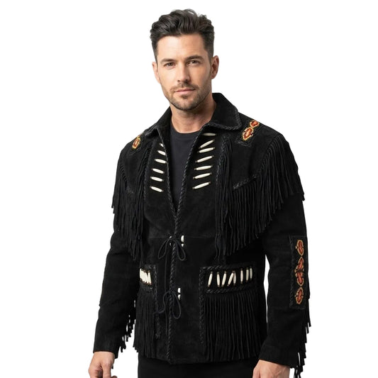 A man wearing a black suede fringed jacket with white beadwork and orange embroidered details, photographed against a plain white studio background.