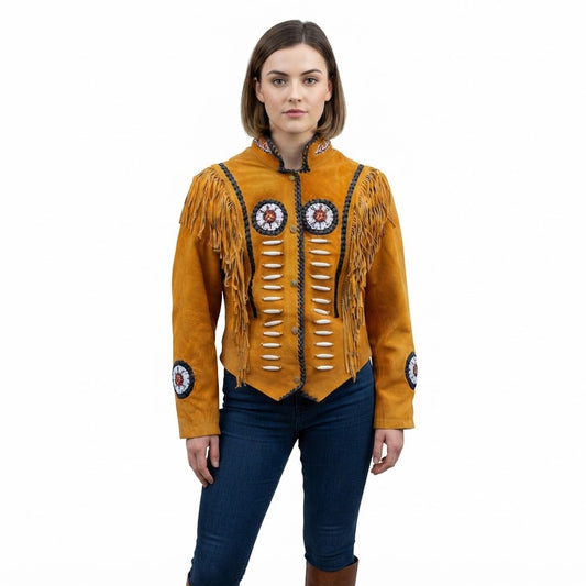 A woman wear a brown suede fringe jacket with intricate bead work and circular embroidered details on the chest and sleeves, paired with dark blue jeans against a plain white background.