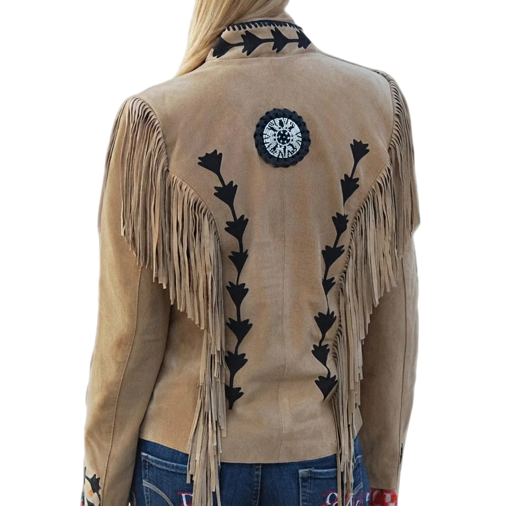 Woman wearing a tan fringe jacket with decorative patterns on a white background