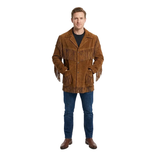 A man modeling a brown suede fringe jacket over a black shirt, blue jeans, and brown boots, standing against a plain white studio background.