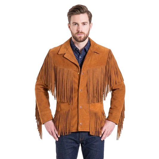 A man wearing a brown suede fringe jacket over a blue patterned shirt and dark jeans, standing against a plain white studio background.