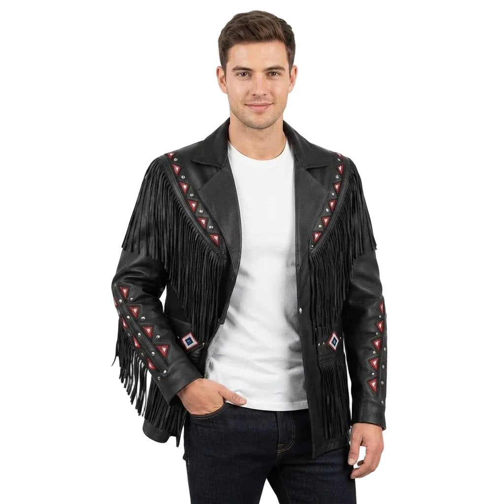 A man modeling a black leather fringe jacket with red and white geometric beadwork details on the shoulders and sleeves, worn over a white t-shirt and dark jeans against a light gray background.