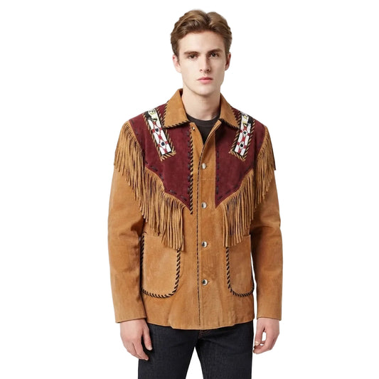 A man wearing a brown suede fringe jacket with a burgundy yoke and geometric bead work on the shoulders, paired with a black t-shirt and dark jeans, against a plain white studio background.