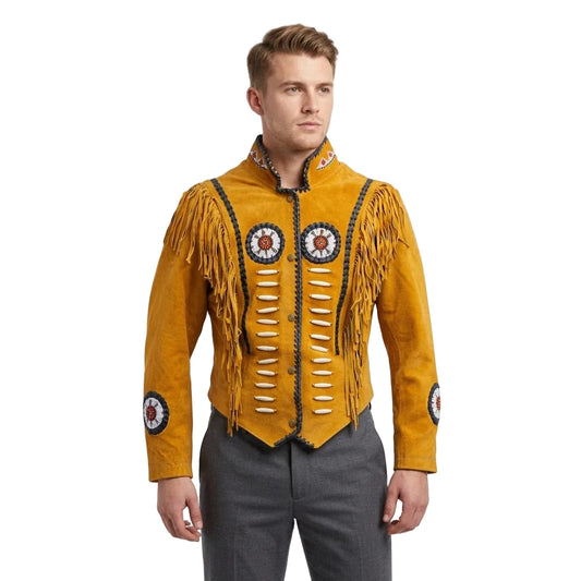 A man wearing a brown suede fringed jacket with circular beaded chest and sleeve emblems, paired with gray trousers, photographed against a plain white studio background.