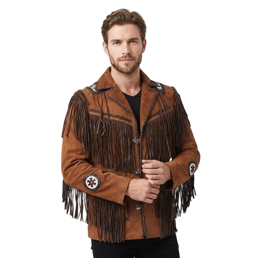A man wearing a brown suede fringe jacket with decorative embroidered patches on the sleeves, photographed against a light gray studio background.